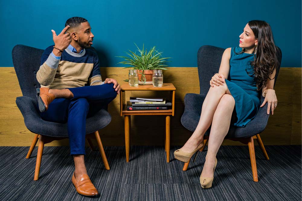 A man and a woman discussing money heatedly